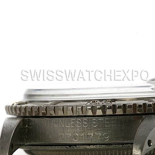 The image shows a side view of the stainless steel case of a Vintage Collection Rolex watch, focusing on the bezel and part of the case.
