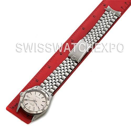 The Rolex Vintage Collection 1625 Men's Stainless Steel Silver Dial 1625 Men's Stainless Steel Silver Dial watch is shown from the top view, including the face, bracelet, and clasp, measuring next to a red ruler.