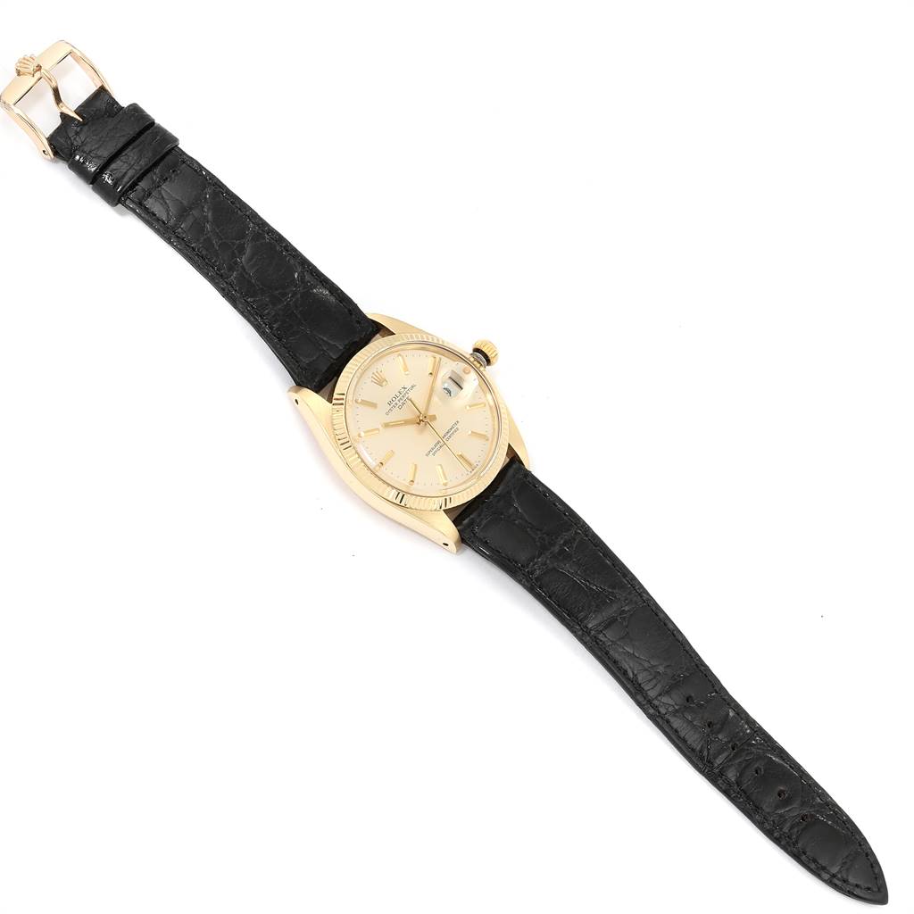 The Rolex Vintage Collection 1503 Men
s Yellow Gold Silver Dial 1503 Men
s Yellow Gold Silver Dial watch is shown at a slight angle with its face and black leather strap visible.