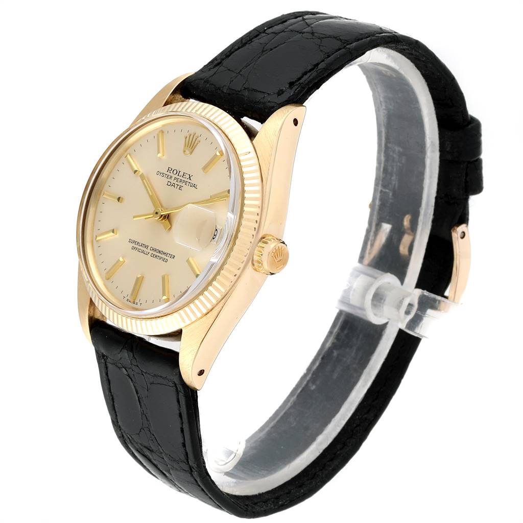 The image shows a side angled view of the Rolex Vintage Collection 1503 Men
s Yellow Gold Silver Dial 1503 Men
s Yellow Gold Silver Dial watch, highlighting its face, bezel, crown, and black leather strap.
