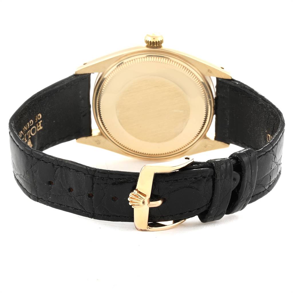 This image shows the back of a Vintage Collection model Rolex watch, highlighting its case and black leather strap.