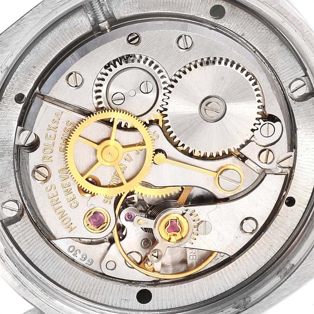 This image shows the internal mechanism of a Vintage Collection by Rolex, highlighting gears and components.