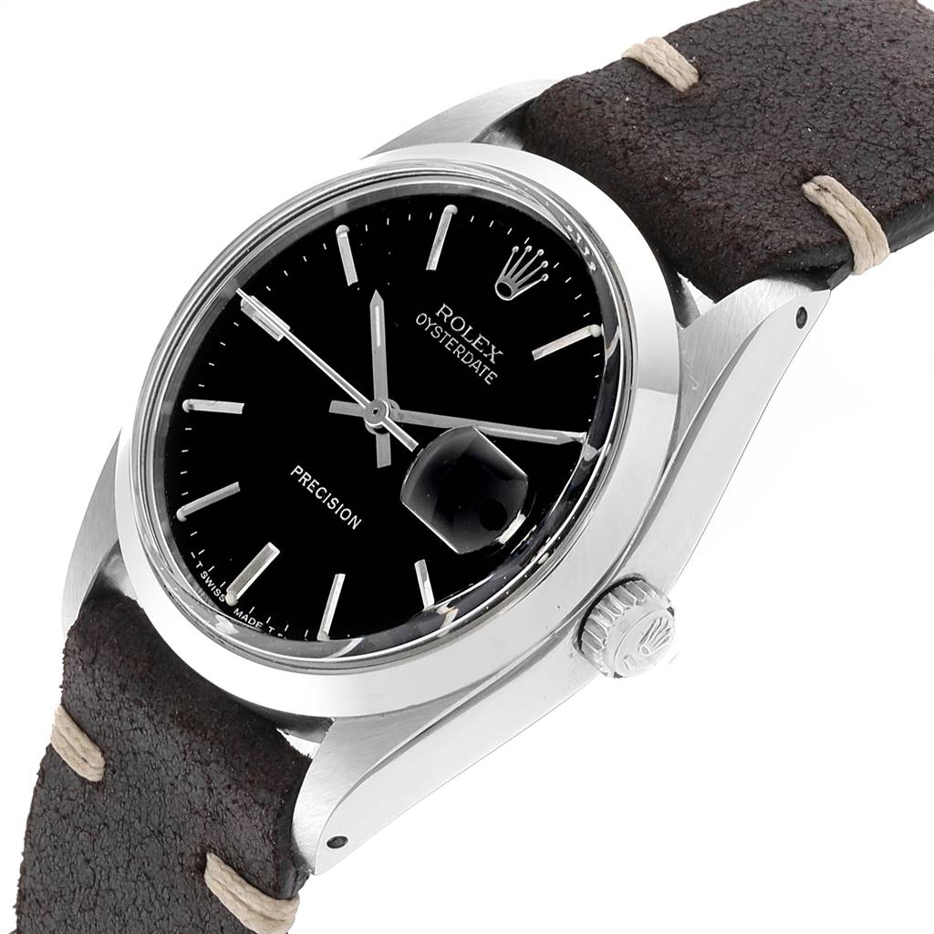 This image shows the face and crown of the Rolex Vintage Collection 6694 Men's Stainless Steel Black Dial 6694 Men's Stainless Steel Black Dial watch at a slightly angled side view.