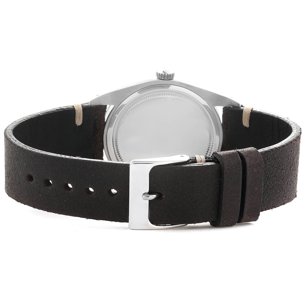 The image shows the back view of the Vintage Collection Rolex watch, highlighting the case back and leather strap with buckle.