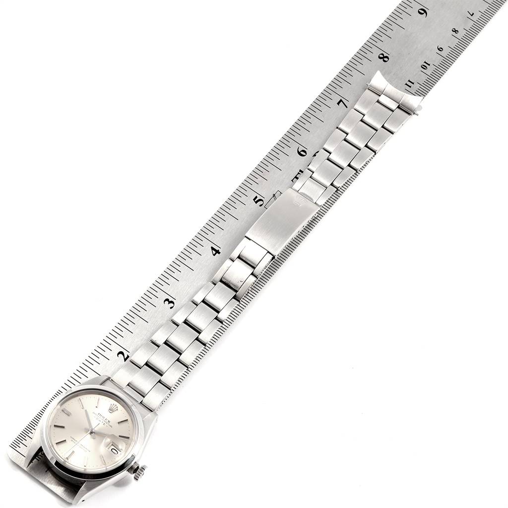 The image shows a top-down view of a Rolex Vintage Collection 1500 Men's Stainless Steel Silver Dial 1500 Men's Stainless Steel Silver Dial watch with a stainless steel bracelet, measured with a ruler.