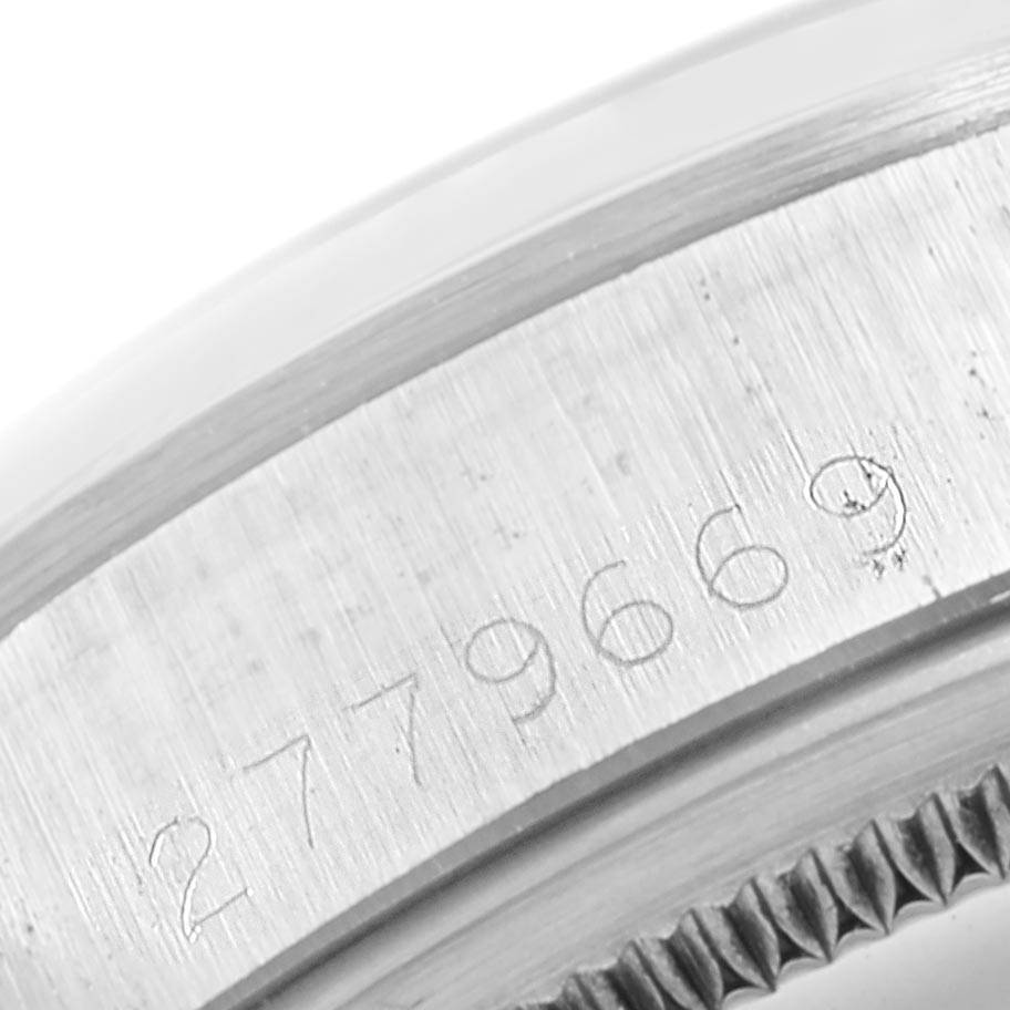 The image shows a close-up of the serial number on the case of a Vintage Collection model by Rolex.