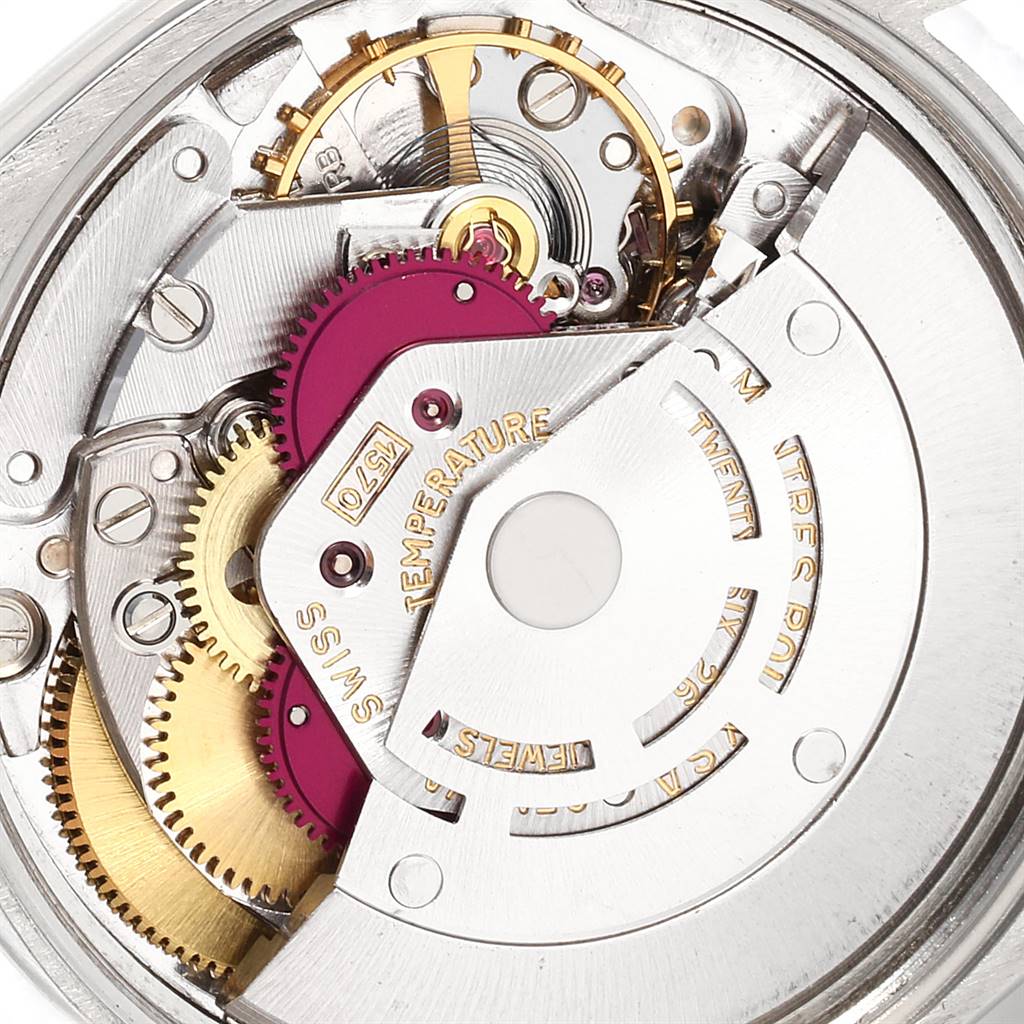 The image shows the intricate internal mechanism of the Vintage Collection Rolex watch from a close-up angle.