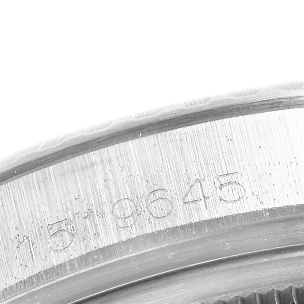 This close-up image shows the engraved serial number on the case edge of a Rolex Vintage Collection 1603 Men's Stainless Steel Silver Dial 1603 Men's Stainless Steel Silver Dial model.