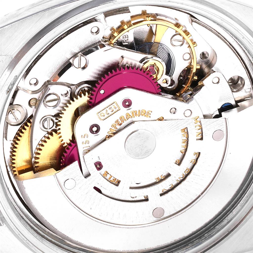 This image shows the intricate movement components of a Rolex Vintage Collection 1601 Men's Stainless Steel Silver Dial 1601 Men's Stainless Steel Silver Dial watch from a close-up angle.
