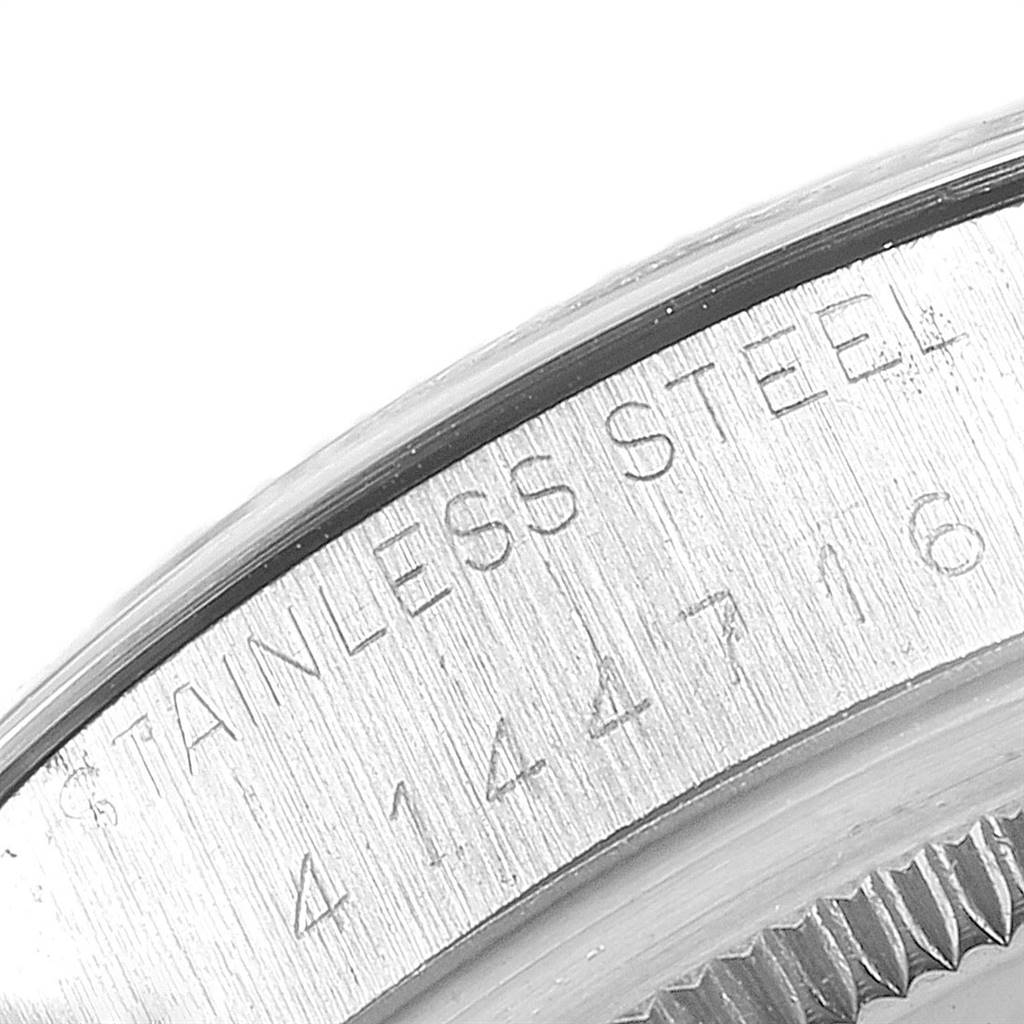 The image shows a close-up of the stainless steel casing and engraved serial number of the Rolex Vintage Collection 1500 Men's Stainless Steel Grey Dial 1500 Men's Stainless Steel Grey Dial watch.