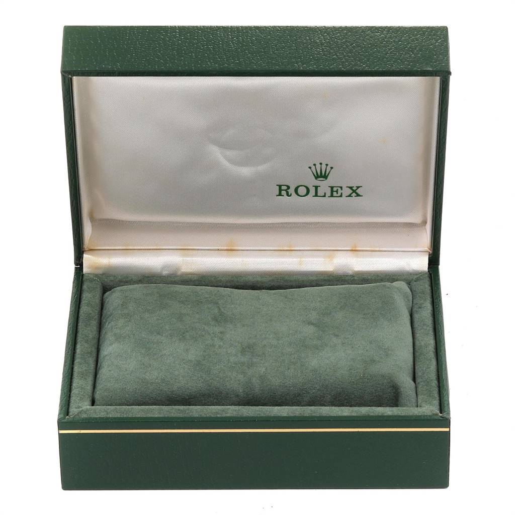 The image shows an empty, open Rolex Vintage Collection 1500 Men's Stainless Steel Grey Dial 1500 Men's Stainless Steel Grey Dial watch box, displaying its green exterior and interior padding.