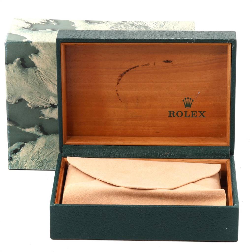 The image shows an open Rolex box from the Vintage Collection model, revealing a soft pouch inside.