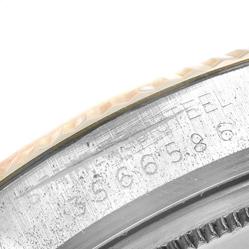The image shows a close-up of the serial number and outer edge of a Rolex Vintage Collection 1601 Men's Steel and Gold (two tone) Champagne Dial 1601 Men's Steel and Gold (two tone) Champagne Dial watch case.