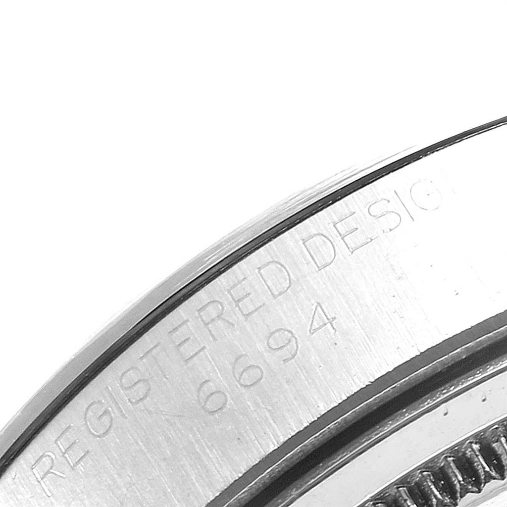 This image shows a close-up of the case side and bezel with etching details on a Rolex Vintage Collection 6694 Men
s Stainless Steel Silver Dial 6694 Men
s Stainless Steel Silver Dial model.