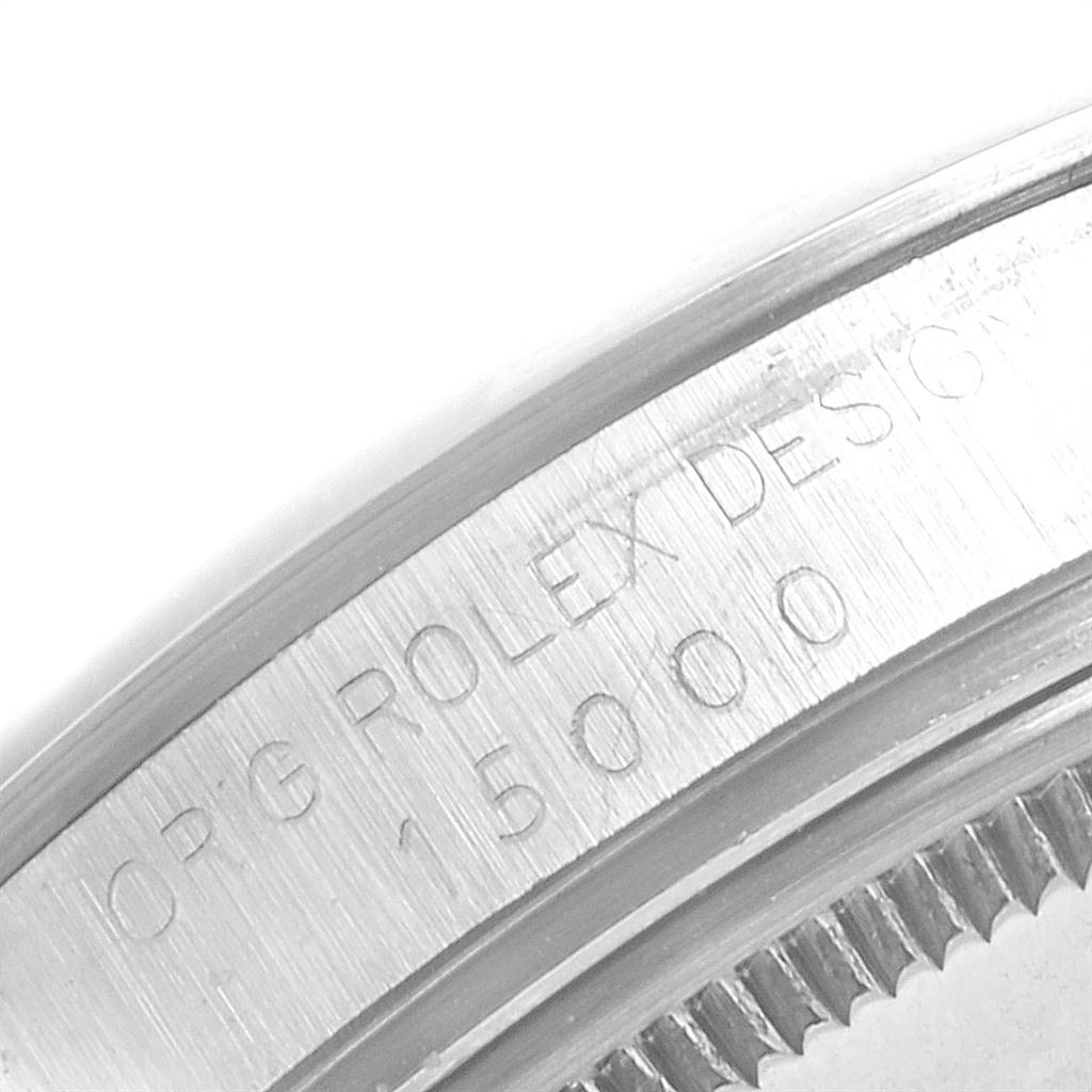 This image shows an up-close, engraved view of the side of a Vintage Collection Rolex watch case.