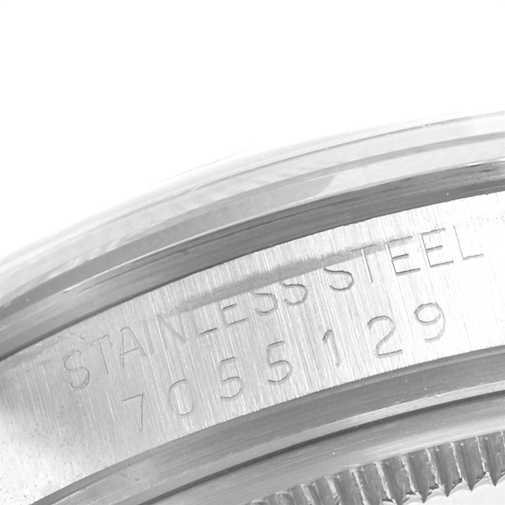 The image shows a close-up of the stainless steel case back with the serial number of a Rolex Vintage Collection 15000 Men's Stainless Steel Blue Dial 15000 Men's Stainless Steel Blue Dial watch.