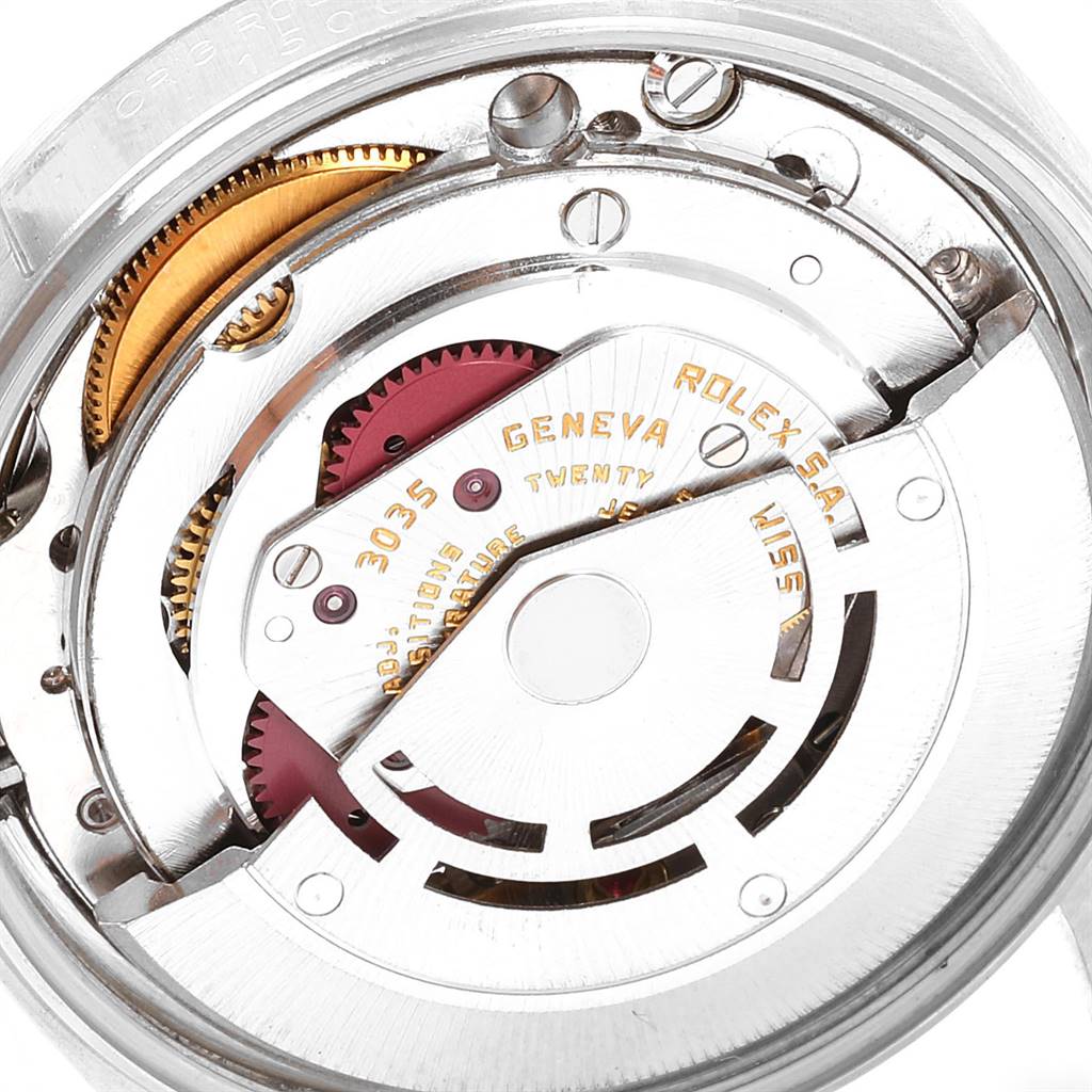 This image shows the inner mechanical movement of a Rolex Vintage Collection 15000 Men's Stainless Steel Blue Dial 15000 Men's Stainless Steel Blue Dial watch, highlighting the gears and inscriptions.