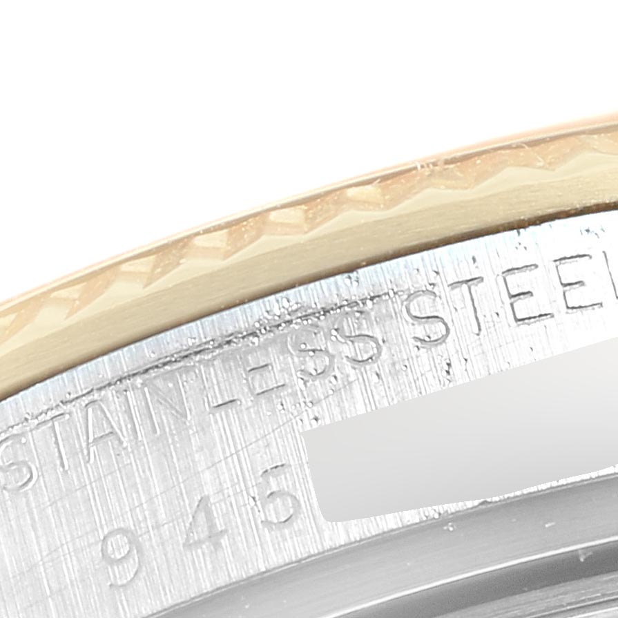 This close-up image of the Rolex Vintage Collection 16013 Men's Stainless Steel Champagne Dial 16013 Men's Stainless Steel Champagne Dial watch shows the stainless steel caseback with partial engravings.