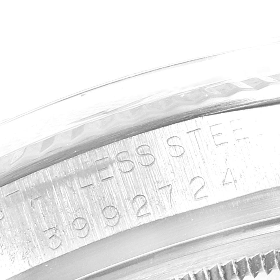 This image shows a close-up of the stainless steel case back with engravings on the Rolex Vintage Collection 1601 Men's Stainless Steel Silver Dial 1601 Men's Stainless Steel Silver Dial model.