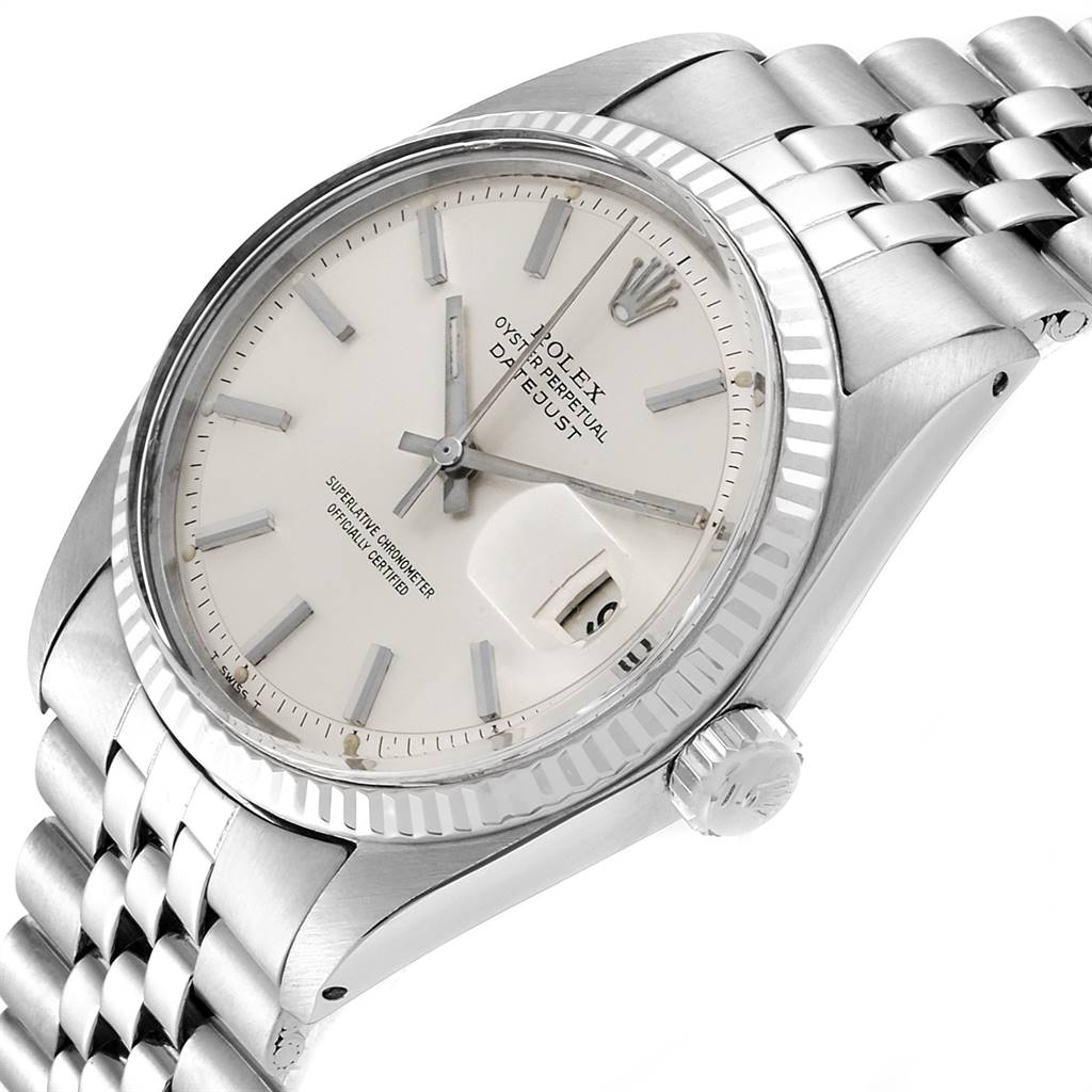 The Vintage Collection Rolex watch is shown at a slightly angled close-up, highlighting the dial, bezel, and bracelet.