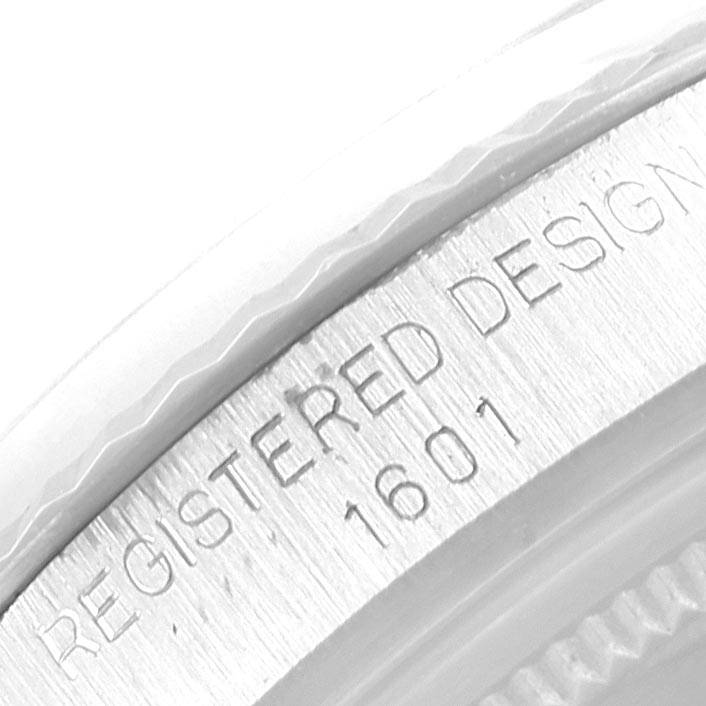 The image shows the engraved model number "1601" on the side of a Rolex Vintage Collection 1601 Men's Stainless Steel Silver Dial 1601 Men's Stainless Steel Silver Dial watch case.