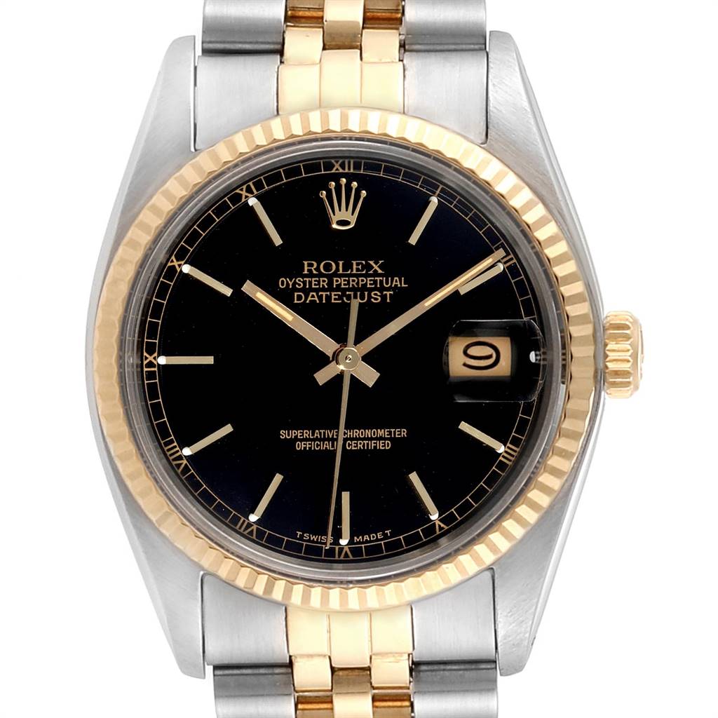 The image shows a front view of the Rolex Vintage Collection 16013 Men's Stainless Steel Black Dial 16013 Men's Stainless Steel Black Dial Datejust watch, highlighting its black dial, gold bezel, and two-tone bracelet.