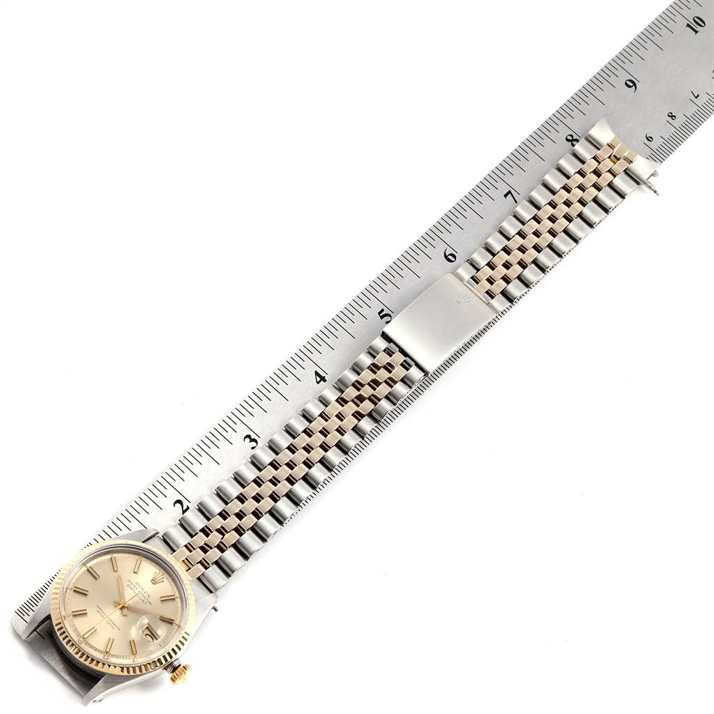 This image shows a side and top view of a Vintage Collection Rolex watch, prominently featuring the dial, casing, and metal strap.