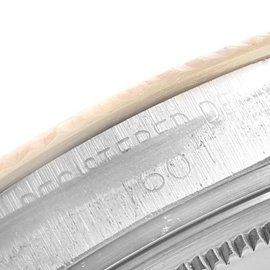 This image shows a close-up of the engraved bezel and part of the case of the Rolex Vintage Collection 1601 Men
s Steel and Gold (two tone) Champagne Dial 1601 Men
s Steel and Gold (two tone) Champagne Dial watch model.