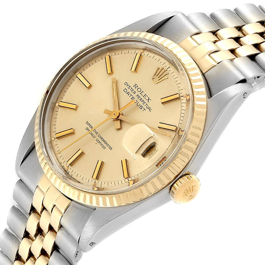 The image shows the face, bezel, crown, and part of the bracelet of the Rolex Vintage Collection 1601 Men
s Steel and Gold (two tone) Champagne Dial 1601 Men
s Steel and Gold (two tone) Champagne Dial model, angled slightly from the top right.