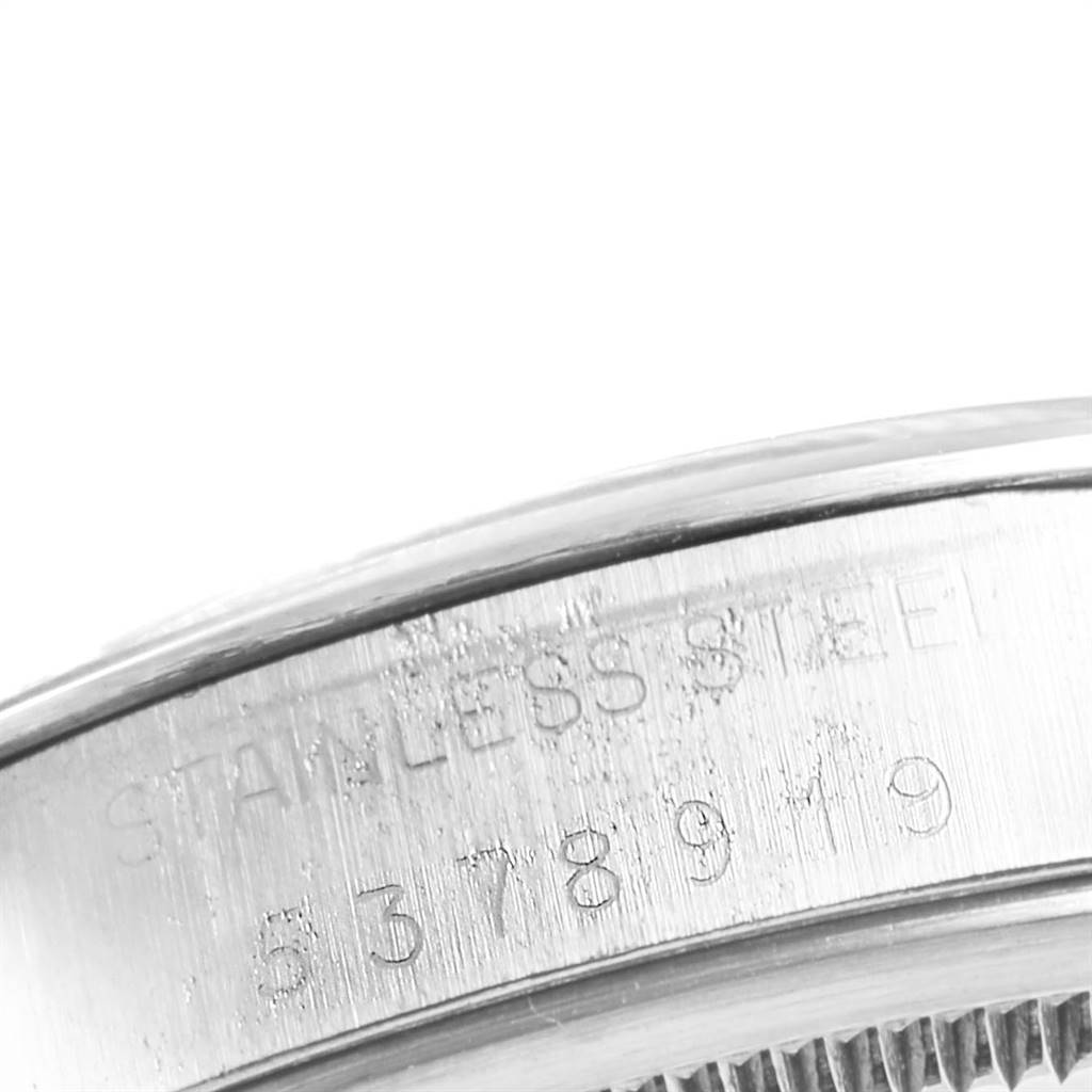 The image shows the side of the case of a Rolex Vintage Collection 1500 Men's Stainless Steel Silver Dial 1500 Men's Stainless Steel Silver Dial watch, displaying inscriptions and serial numbers.