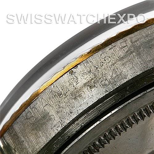 The image shows a close-up of the watch case number and edge of the bezel of a Vintage Collection model by Rolex.