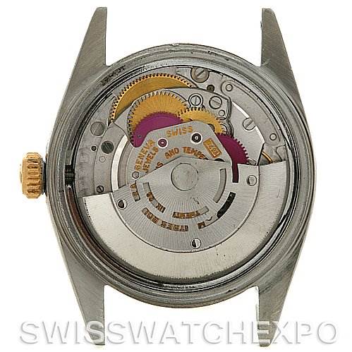 The image shows the back view and internal mechanical movement of a Vintage Collection Rolex watch.