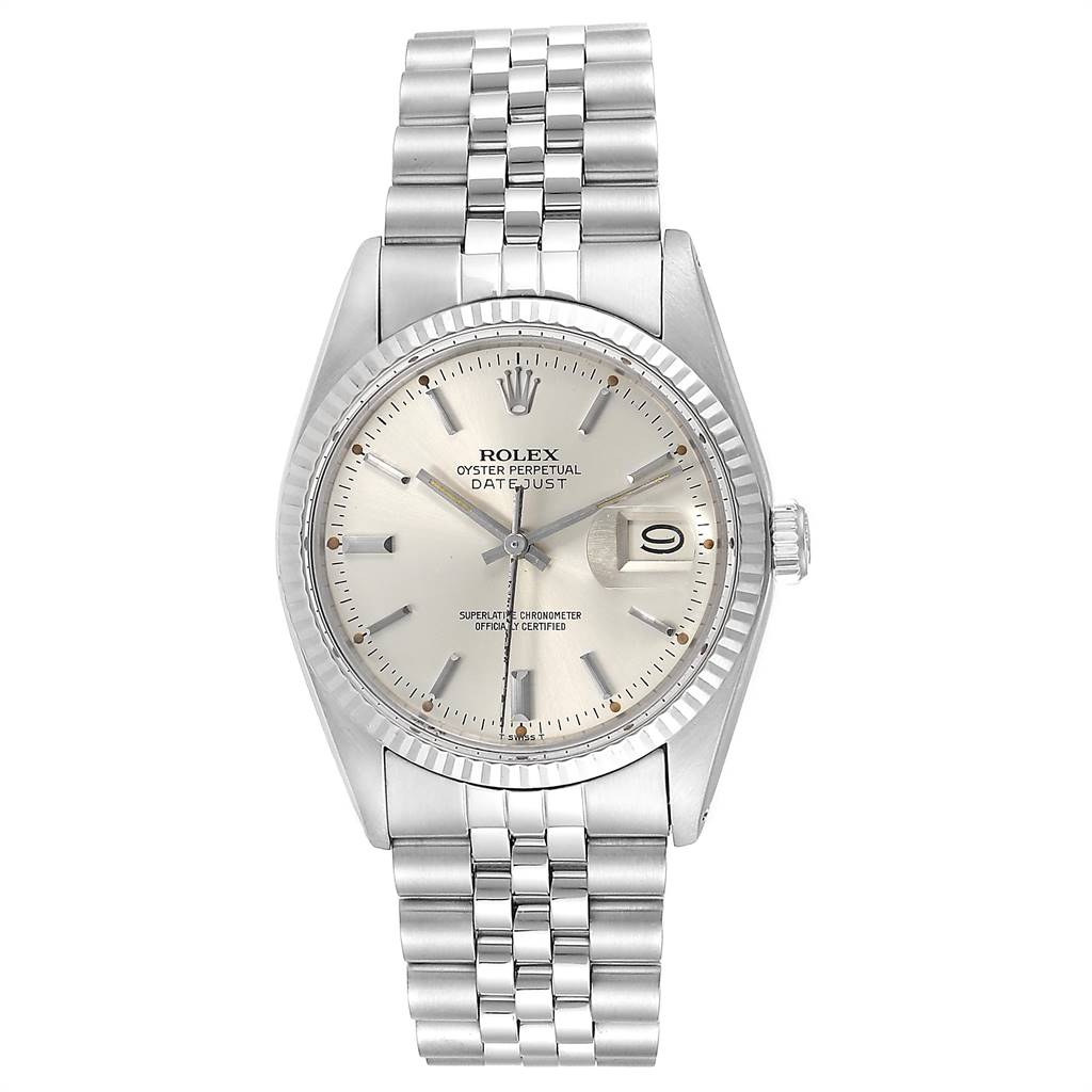The Vintage Collection Rolex watch is shown from a frontal angle, displaying its face, bezel, bracelet, and crown.