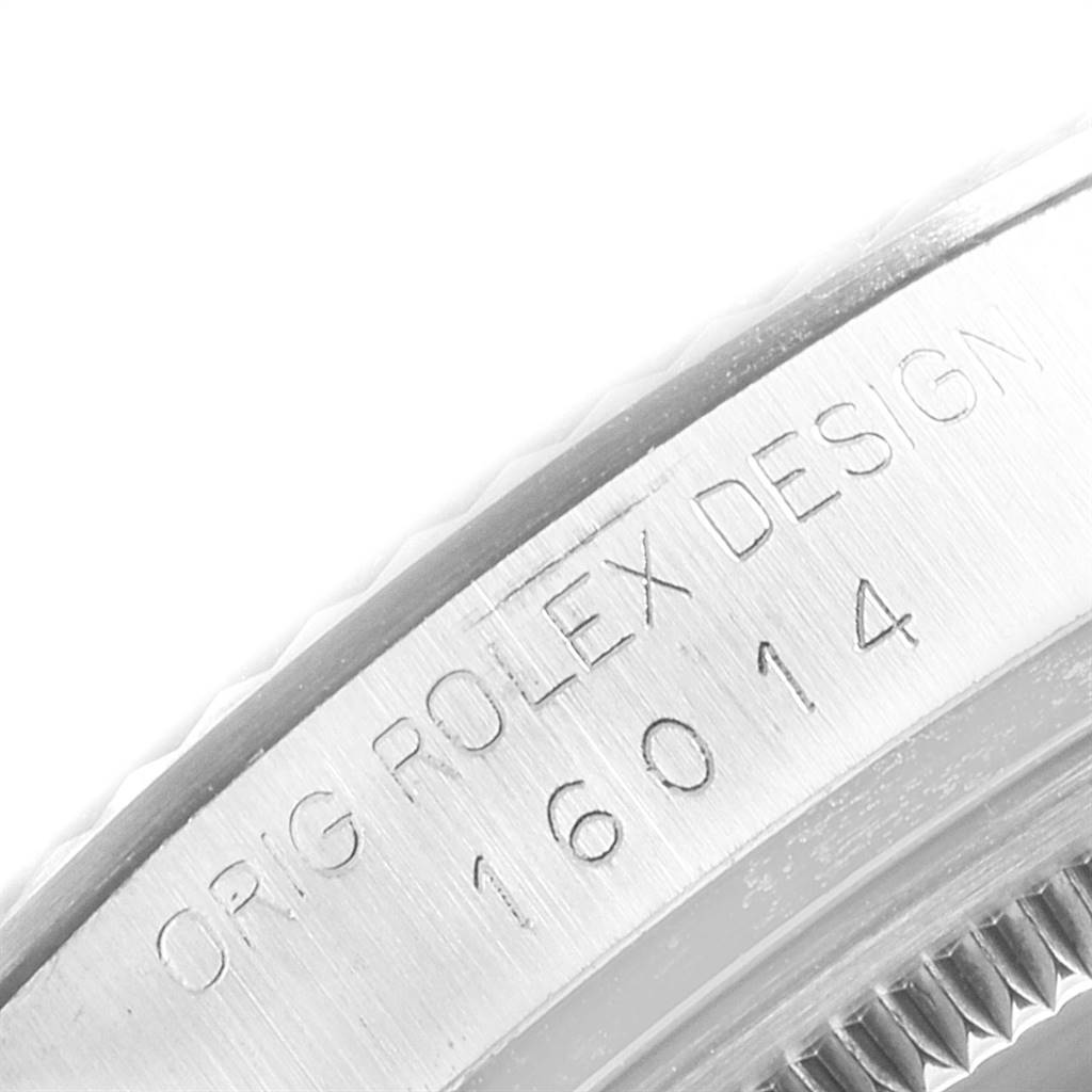 This close-up image shows part of the bezel and serial number of the Vintage Collection model by Rolex.