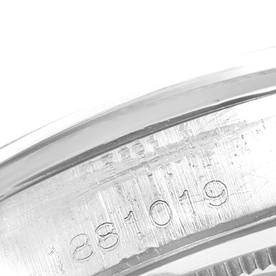 This image shows a close-up view of the serial number on the case back of a Rolex Vintage Collection 6694 Men's Stainless Steel Black Dial 6694 Men's Stainless Steel Black Dial model watch.