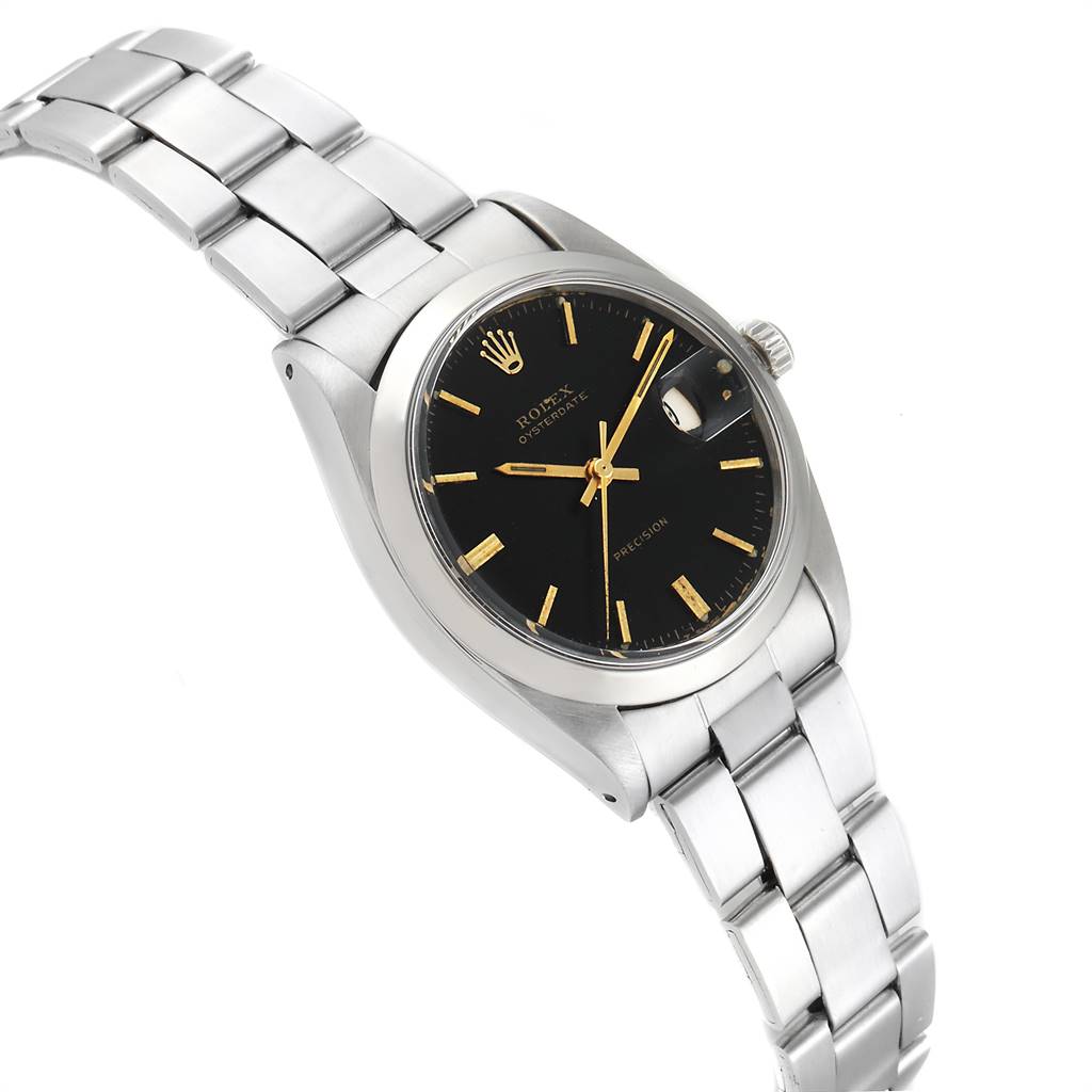 The image shows a side-angle view of the Rolex Vintage Collection 6694 Men's Stainless Steel Black Dial 6694 Men's Stainless Steel Black Dial watch, highlighting the black dial, gold markers, and metal bracelet.