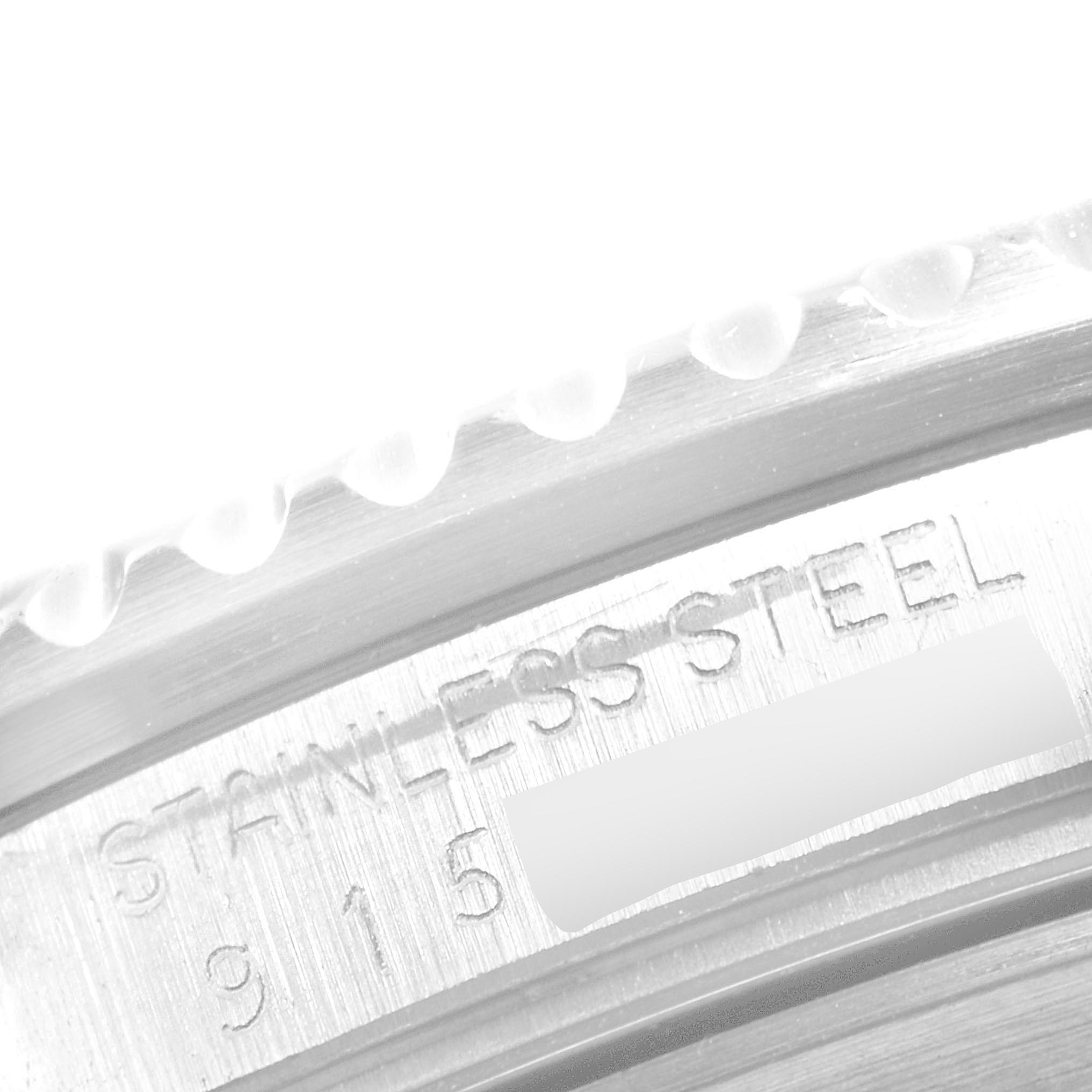 Close-up angle of the stainless steel case and marked engravings on a Vintage Collection Rolex watch.