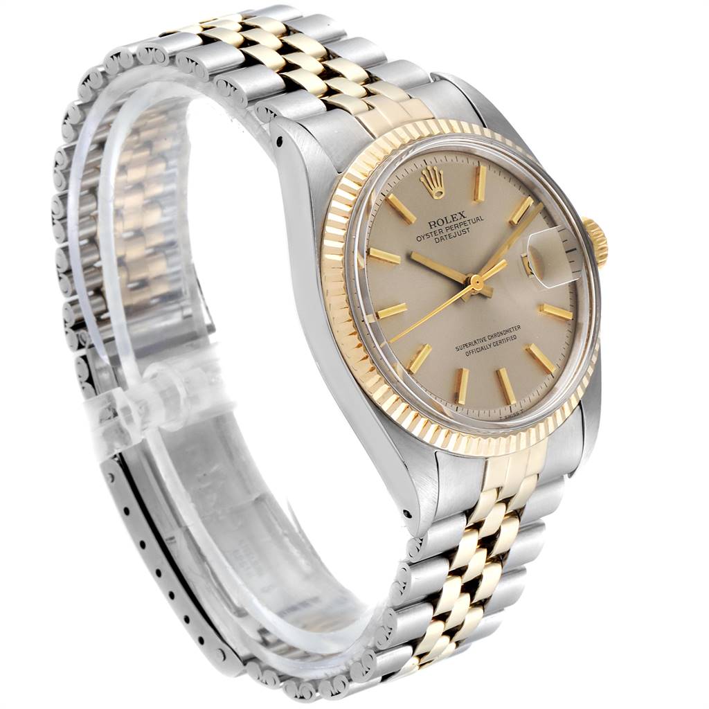 This image shows a side angle of a Rolex Vintage Collection 1601 Men
s Steel and Gold (two tone) Silver Dial 1601 Men
s Steel and Gold (two tone) Silver Dial watch, displaying the face, bezel, crown, and two-tone bracelet.