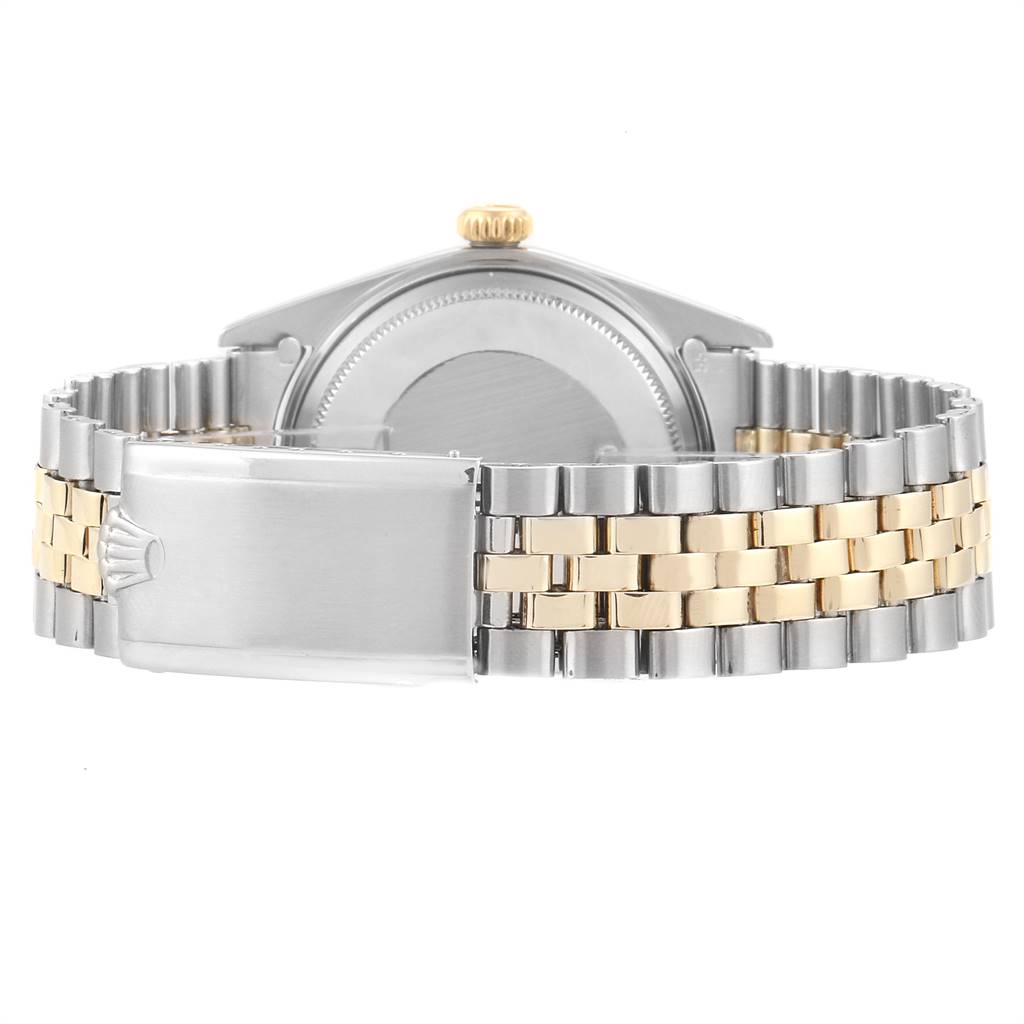 This image shows the back view of a Rolex Vintage Collection 1601 Men
s Steel and Gold (two tone) Silver Dial 1601 Men
s Steel and Gold (two tone) Silver Dial watch, highlighting its clasp and two-tone metal bracelet.