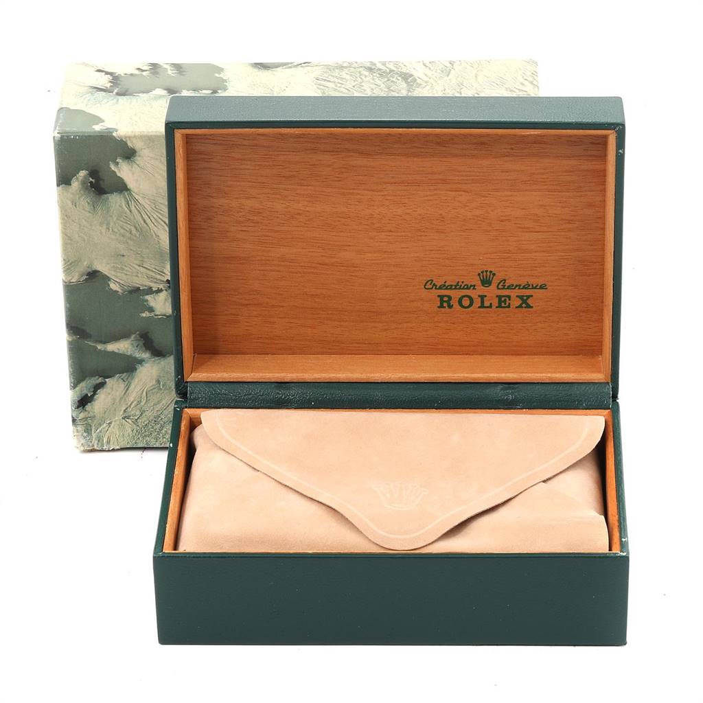 The image shows a Rolex Vintage Collection 1601 Men
s Steel and Gold (two tone) Silver Dial 1601 Men
s Steel and Gold (two tone) Silver Dial watch box and a suede pouch inside a wooden display case.