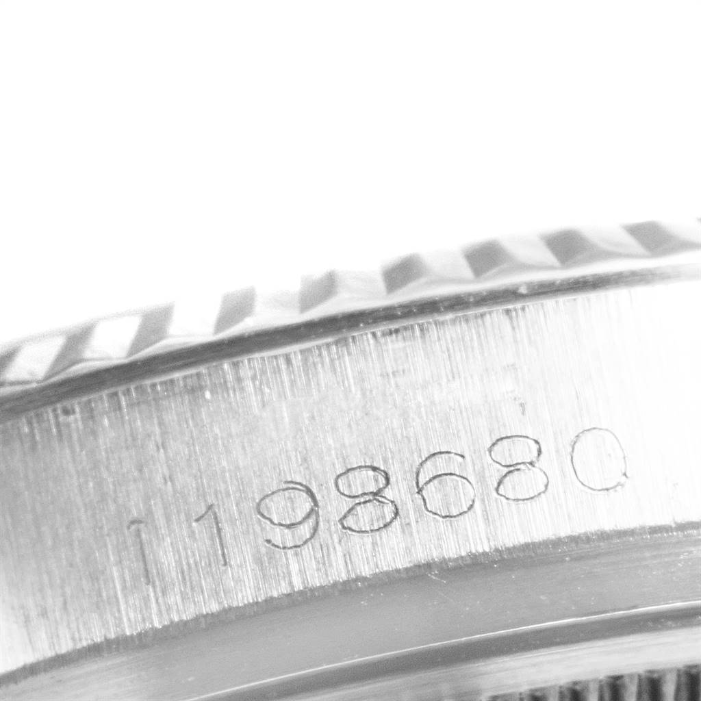 This close-up image shows the edge and part of the serial number on the case of a Vintage Collection model by Rolex.