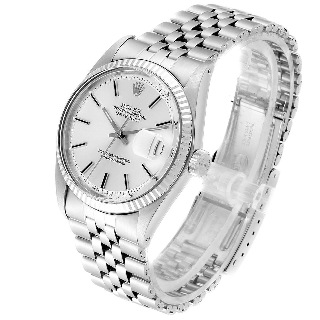 The Vintage Collection Rolex watch is shown at a three-quarter angle, displaying the face, crown, and stainless steel bracelet.