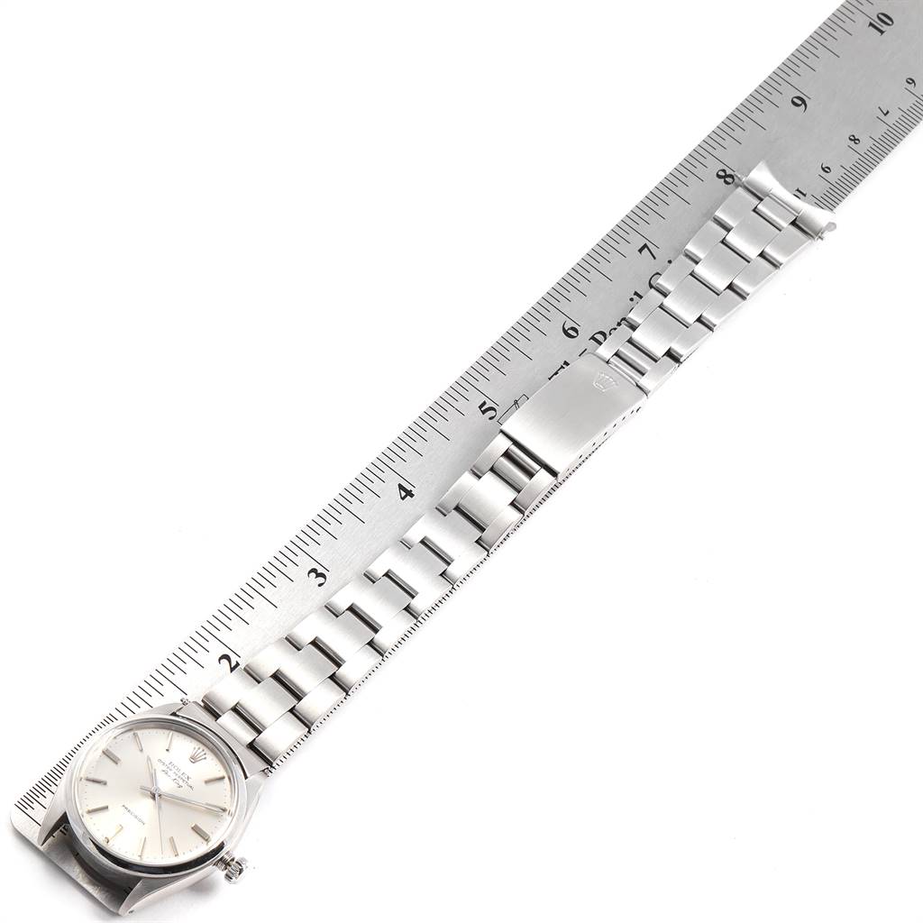 The Rolex Vintage Collection 5500 Men's Stainless Steel Silver Dial 5500 Men's Stainless Steel Silver Dial watch is shown from a top-down angle, with its bracelet aligned next to a ruler for measurement.