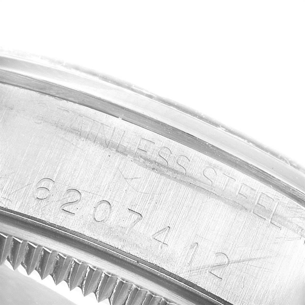 This close-up image shows the serial number and part of the stainless steel case back of the Rolex Vintage Collection 5500 Men's Stainless Steel Silver Dial 5500 Men's Stainless Steel Silver Dial watch.