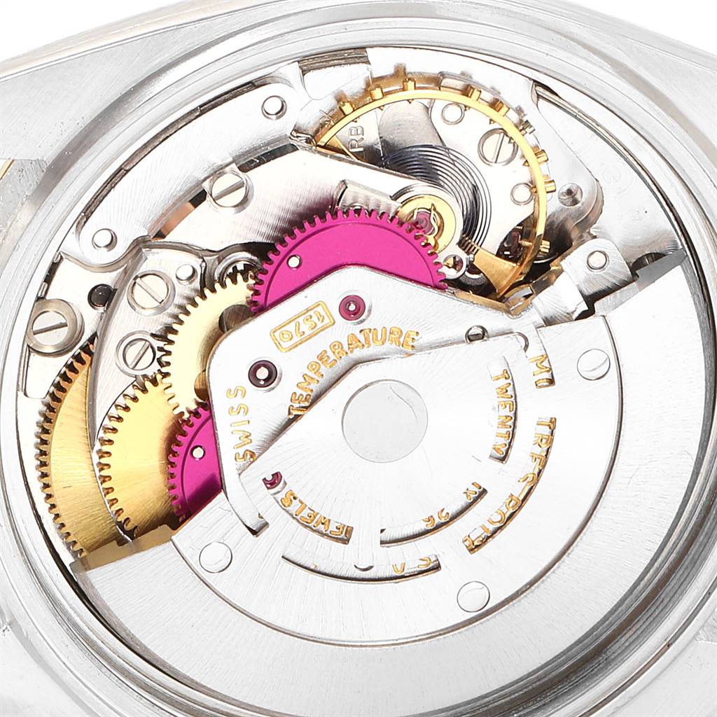 This close-up image shows the intricate internal movement components of a Rolex Vintage Collection 1601 Men's Steel and Gold (two tone) Blue Dial 1601 Men's Steel and Gold (two tone) Blue Dial model watch.