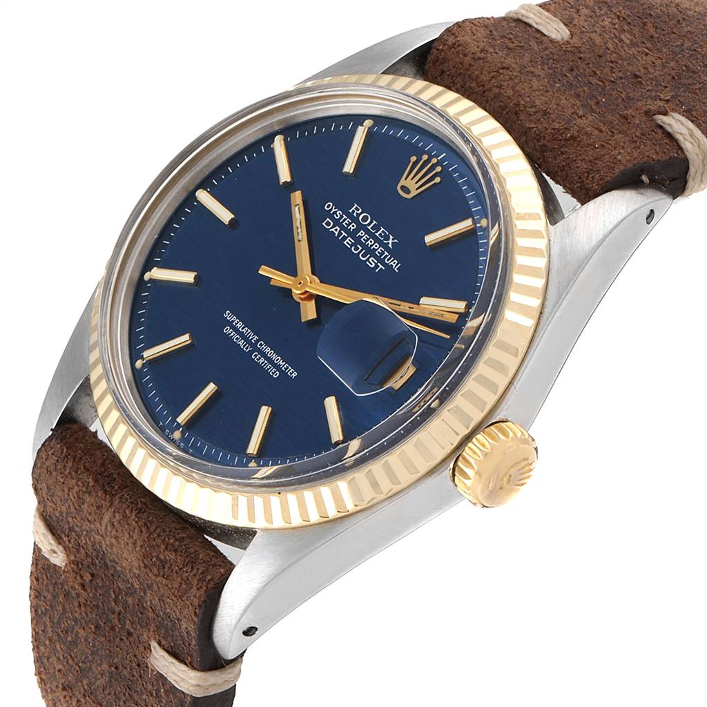 The image shows a close-up angle of the Rolex Vintage Collection 1601 Men's Steel and Gold (two tone) Blue Dial 1601 Men's Steel and Gold (two tone) Blue Dial model, highlighting the dial, bezel, crown, and leather strap.