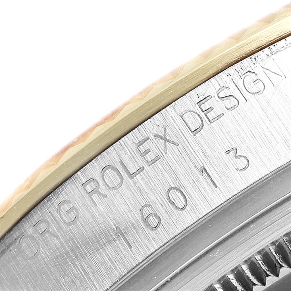The image shows a close-up view focusing on the bezel and engraved side of the Rolex Vintage Collection 16013 Men's Stainless Steel Black Dial 16013 Men's Stainless Steel Black Dial model watch.