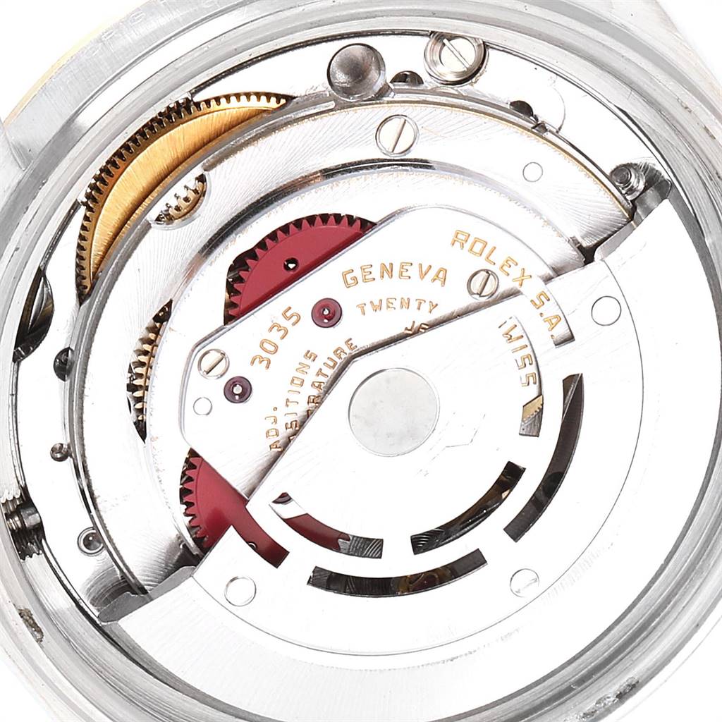 This image displays the intricate internal mechanics of the Vintage Collection Rolex watch, viewed from the back.