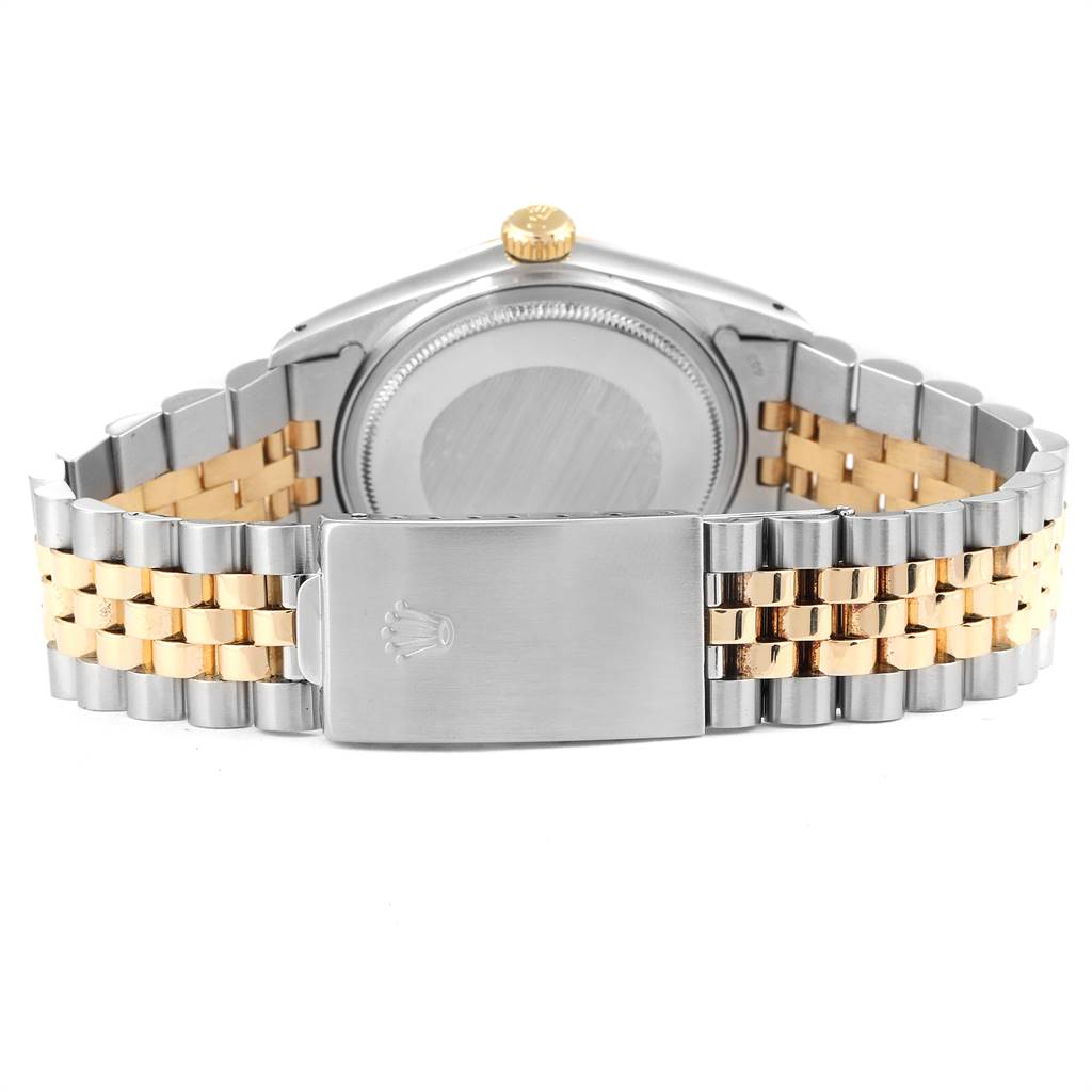 The image shows the back of a Vintage Collection Rolex watch, highlighting the clasp, bracelet, and case back.