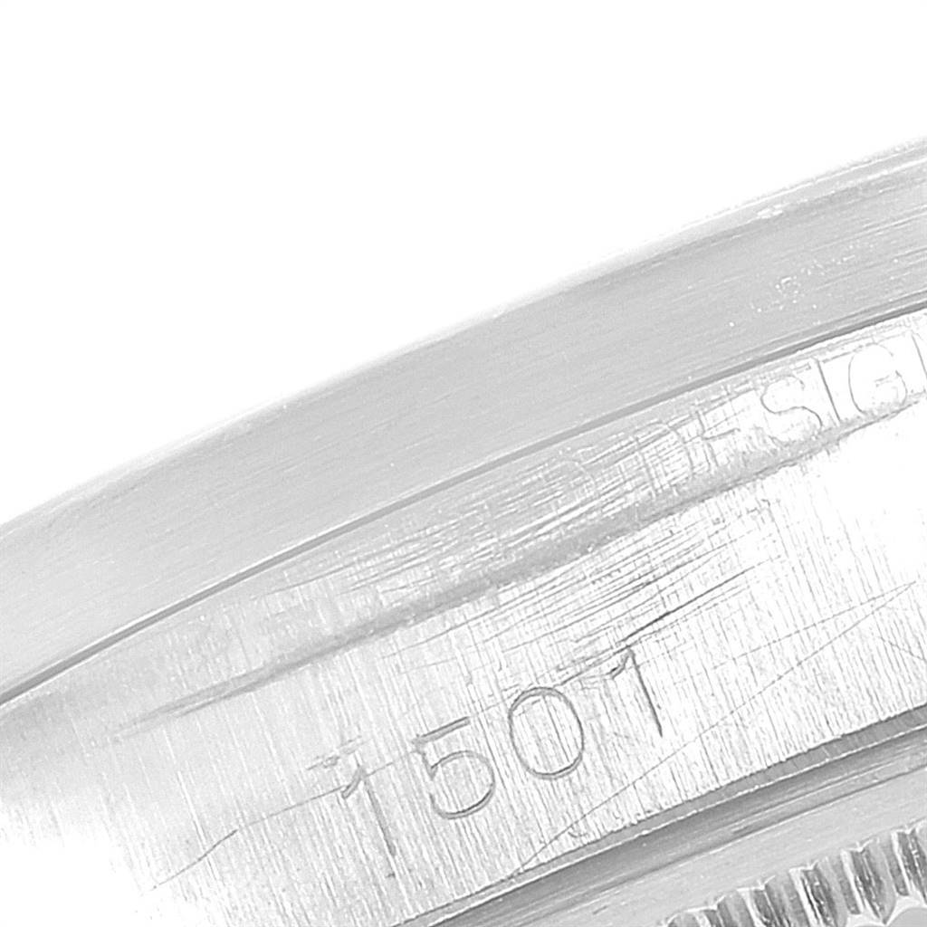 The image shows a detailed close-up of the casing edge with serial engravings on a Rolex Vintage Collection 1501 Men's Stainless Steel Silver Dial 1501 Men's Stainless Steel Silver Dial watch.